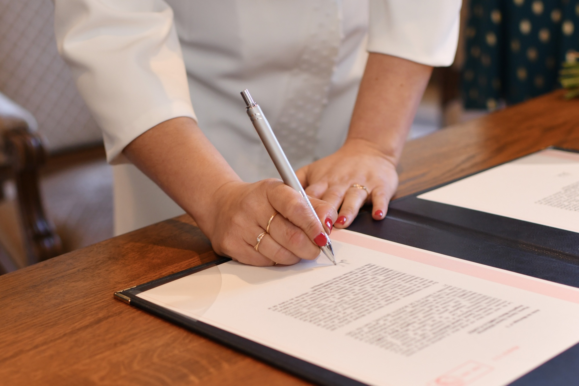 Bride signs documents